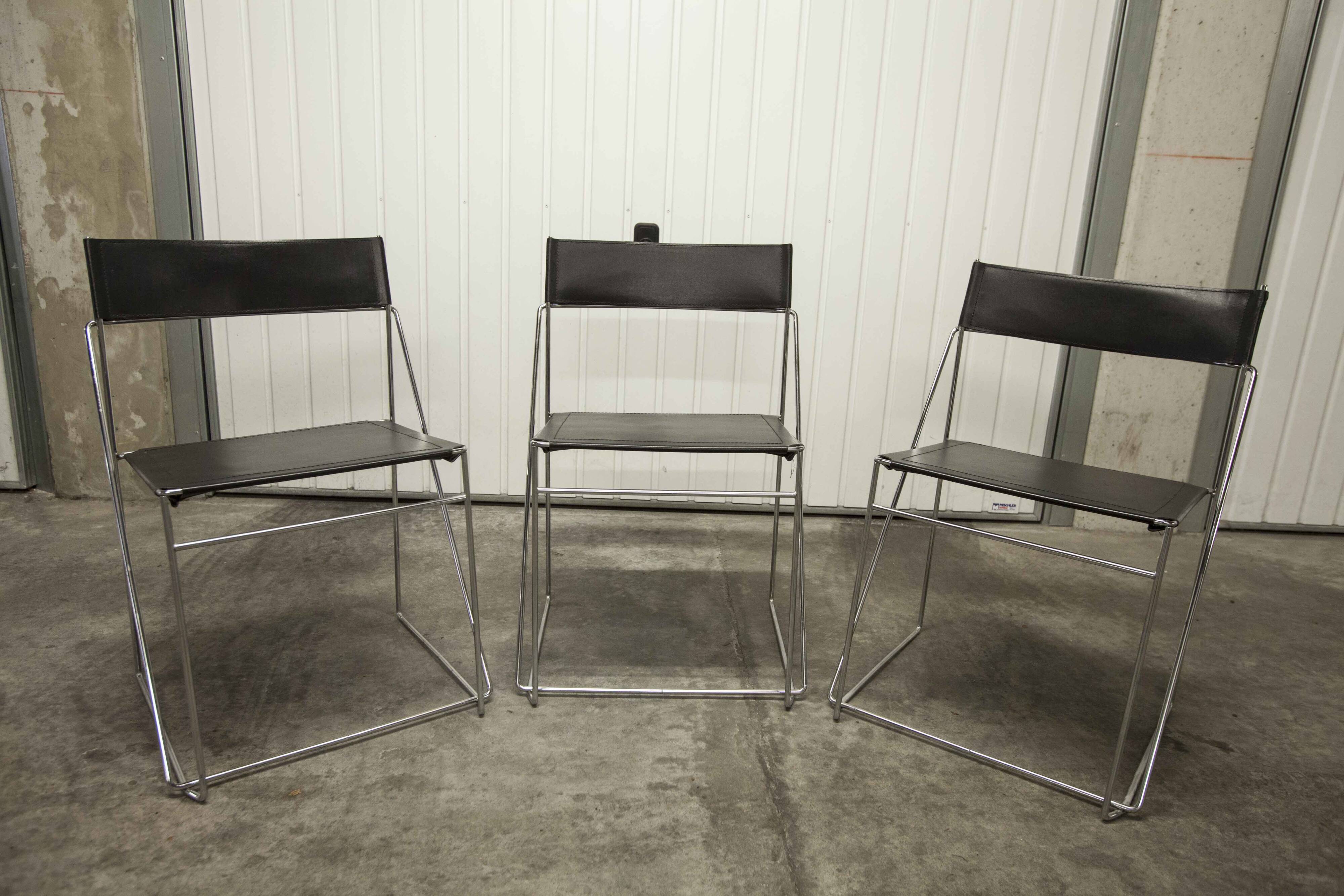 Set of 3 minimalist X line chairs by Niels Jorgen Haugesen.