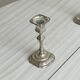 Pair of patinated silver-plated candlesticks