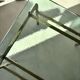 Swedish brass coffee table with a marbled glass top from the 1960s.
