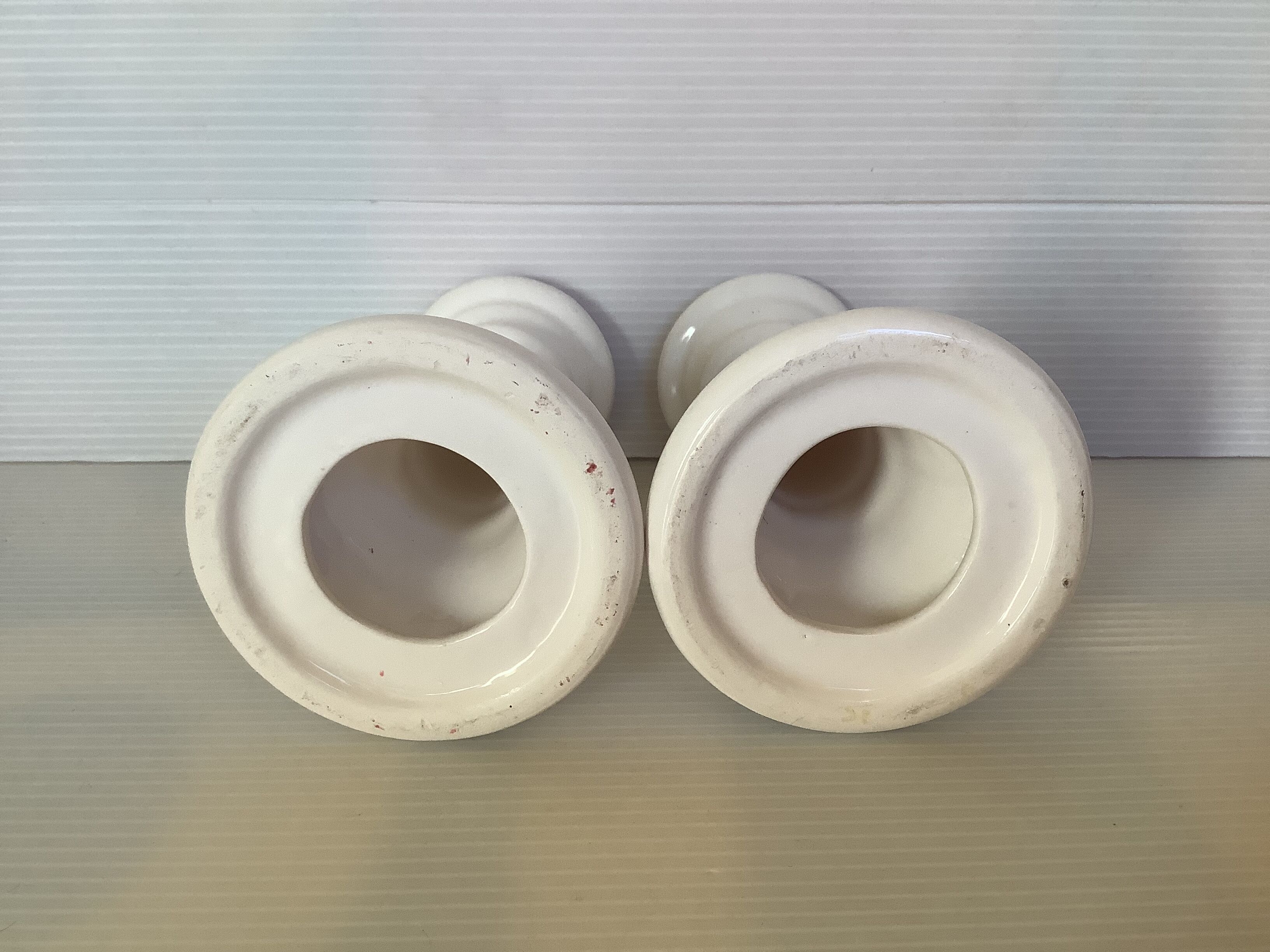 Pair of white earthenware candle holders