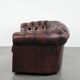 Classic cowhide Chesterfield sofa in English style with red/brown colours