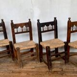 Series of 4 brutalist rustic chairs in carved wood straw seat
