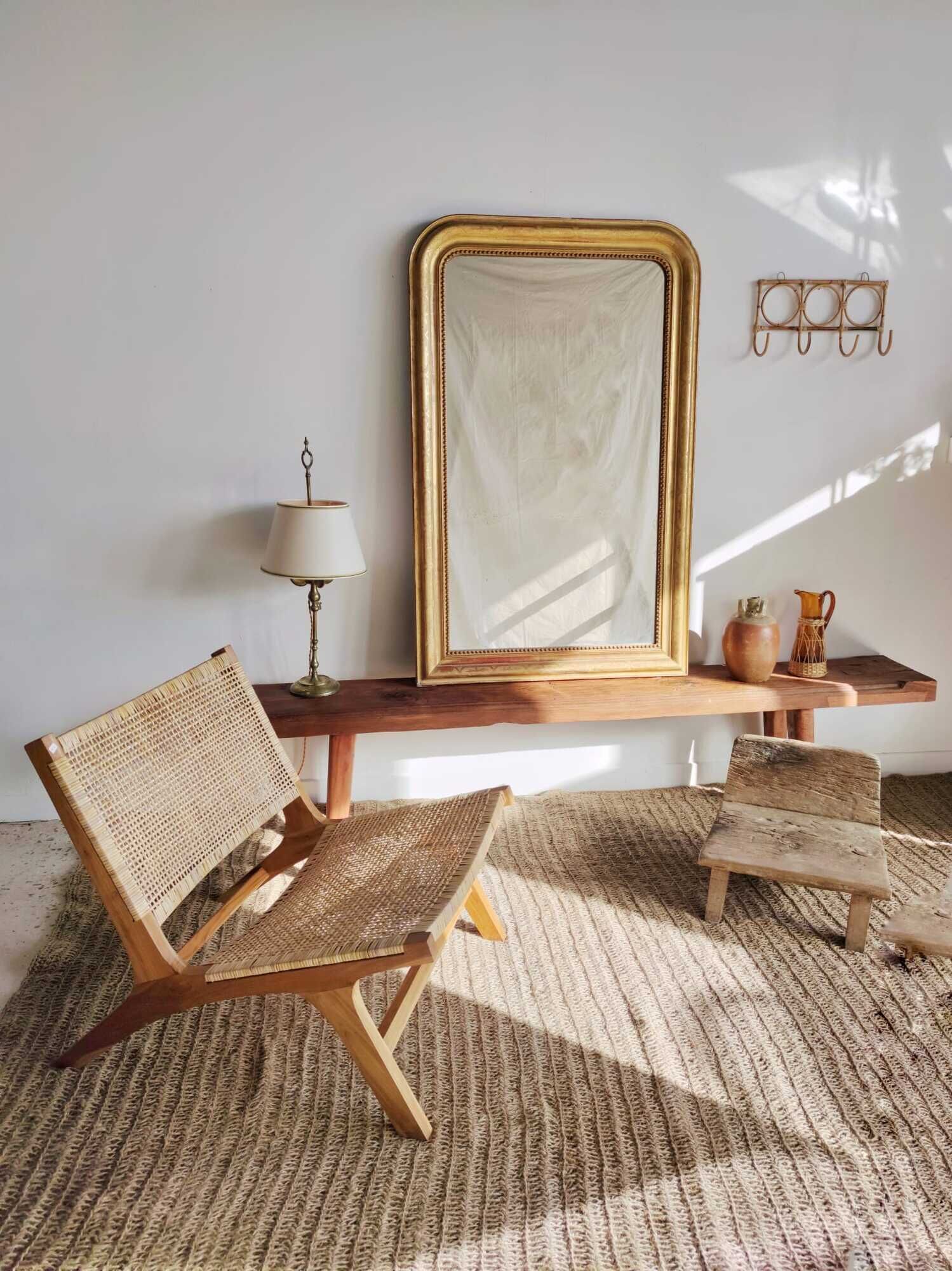 Reclining armchair in natural wood and woven rattan
