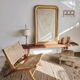Reclining armchair in natural wood and woven rattan