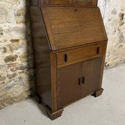 Oak display secretary cabinet with drop-down front, two sections.