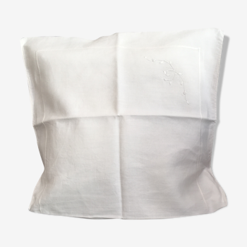 Embroidered white cotton cushion