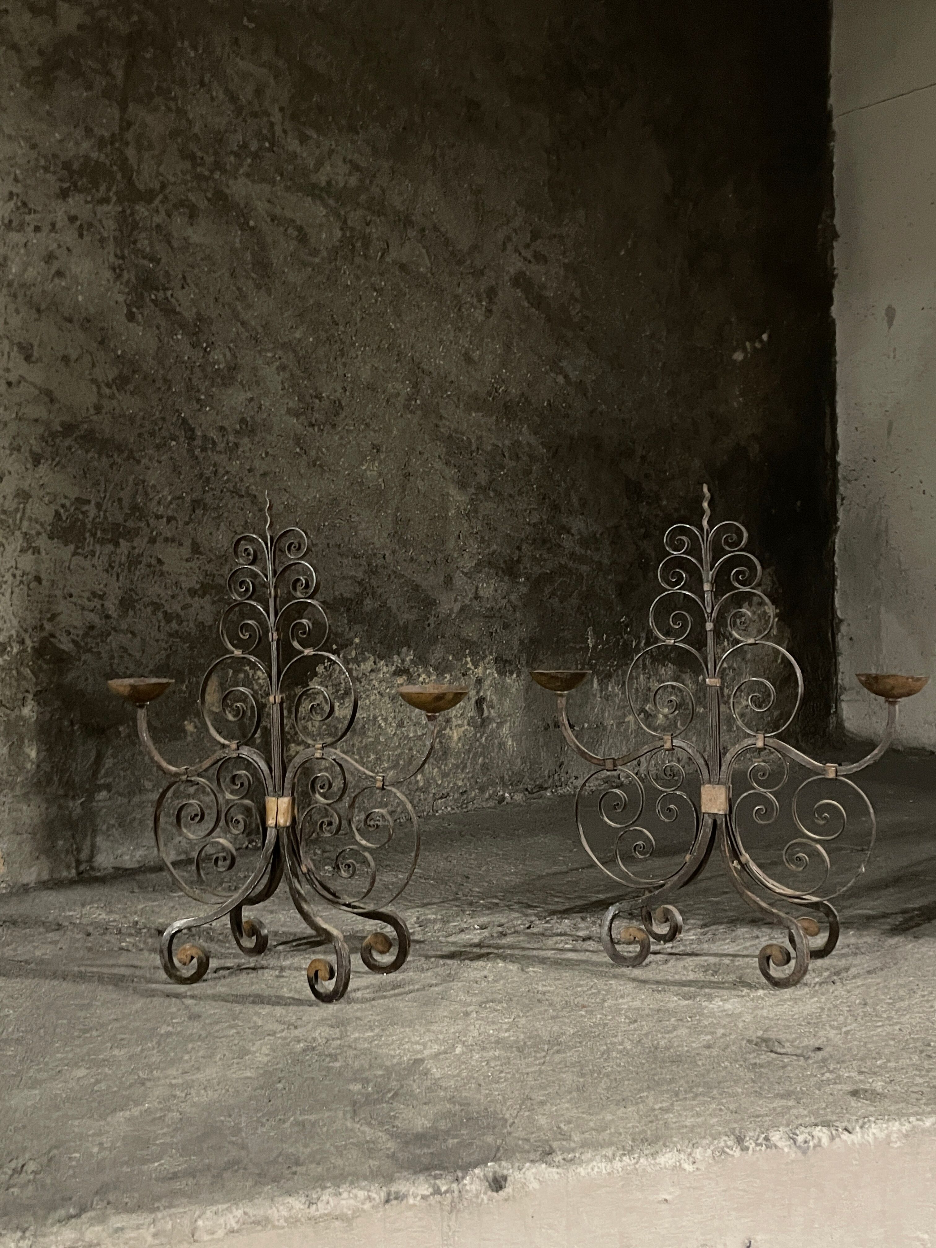 Pair of French wrought iron candelabra from the 19th century.