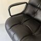 Black leather office chair and armrest by Charles Pollock for Knoll International