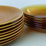 Set of 8 ocher enameled ceramic dinner plates