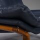 Danish teak and navy blue leather lounge chair from Komfort, 1970s