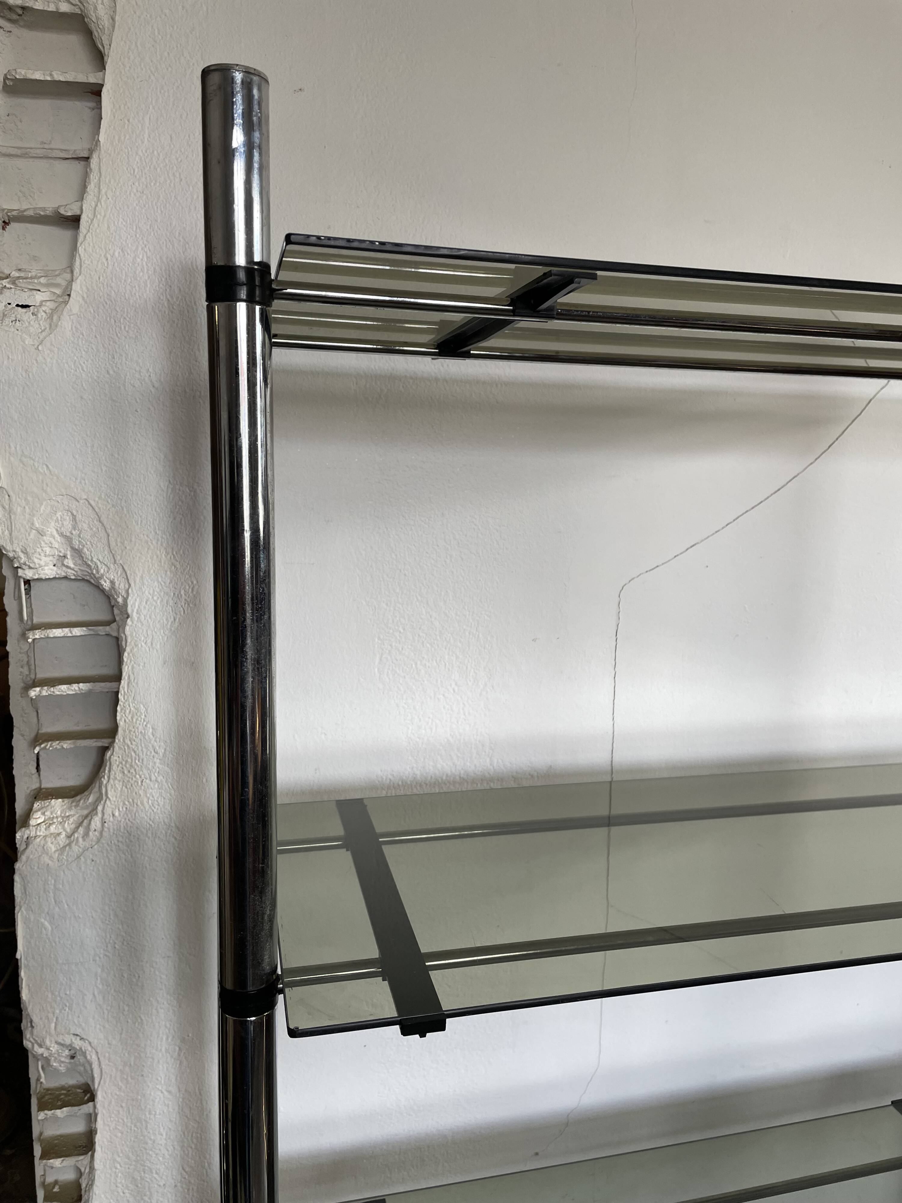 Chromed metal tubular shelf with smoked glass.