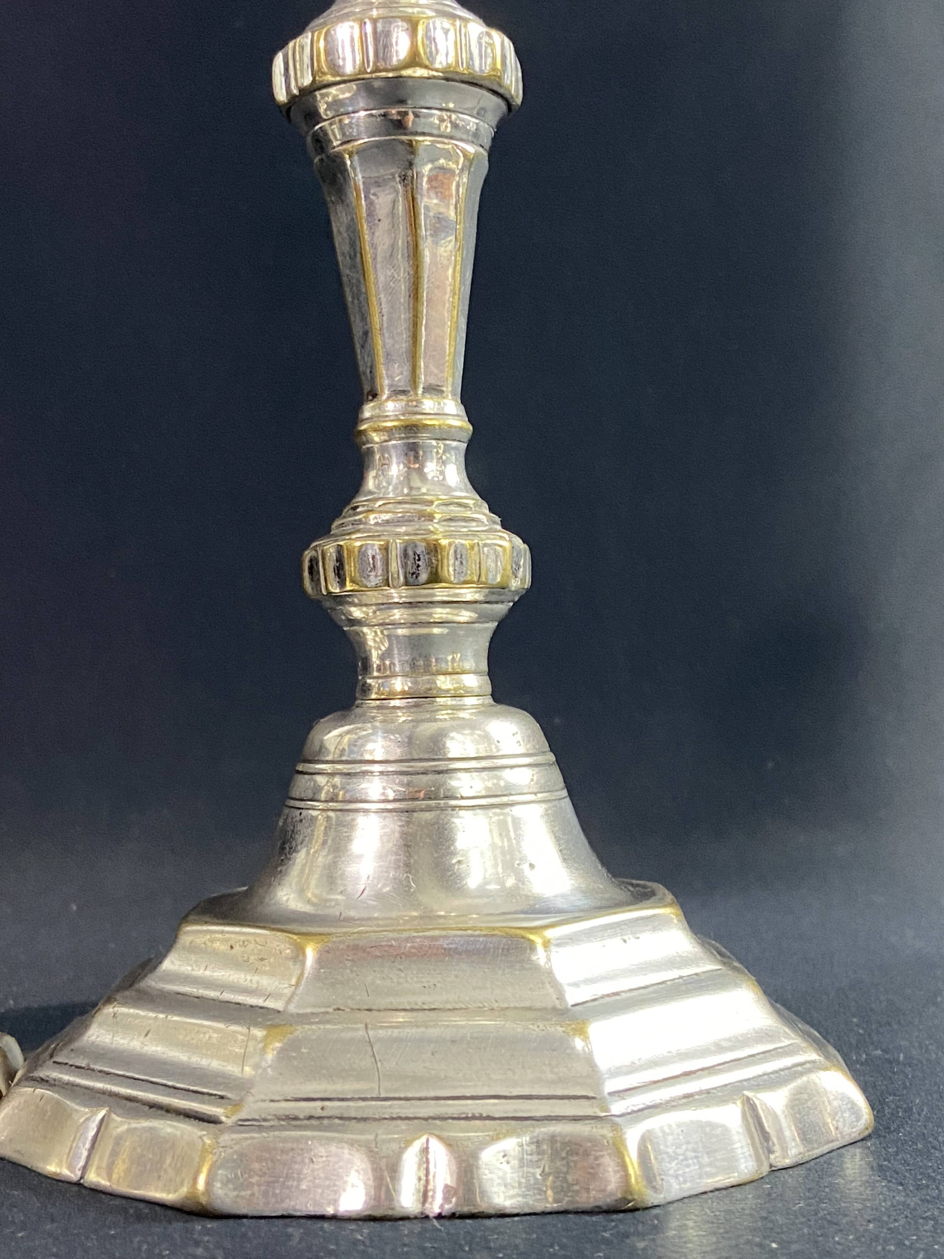 Pair of 18th century Regency candlesticks in silvered bronze