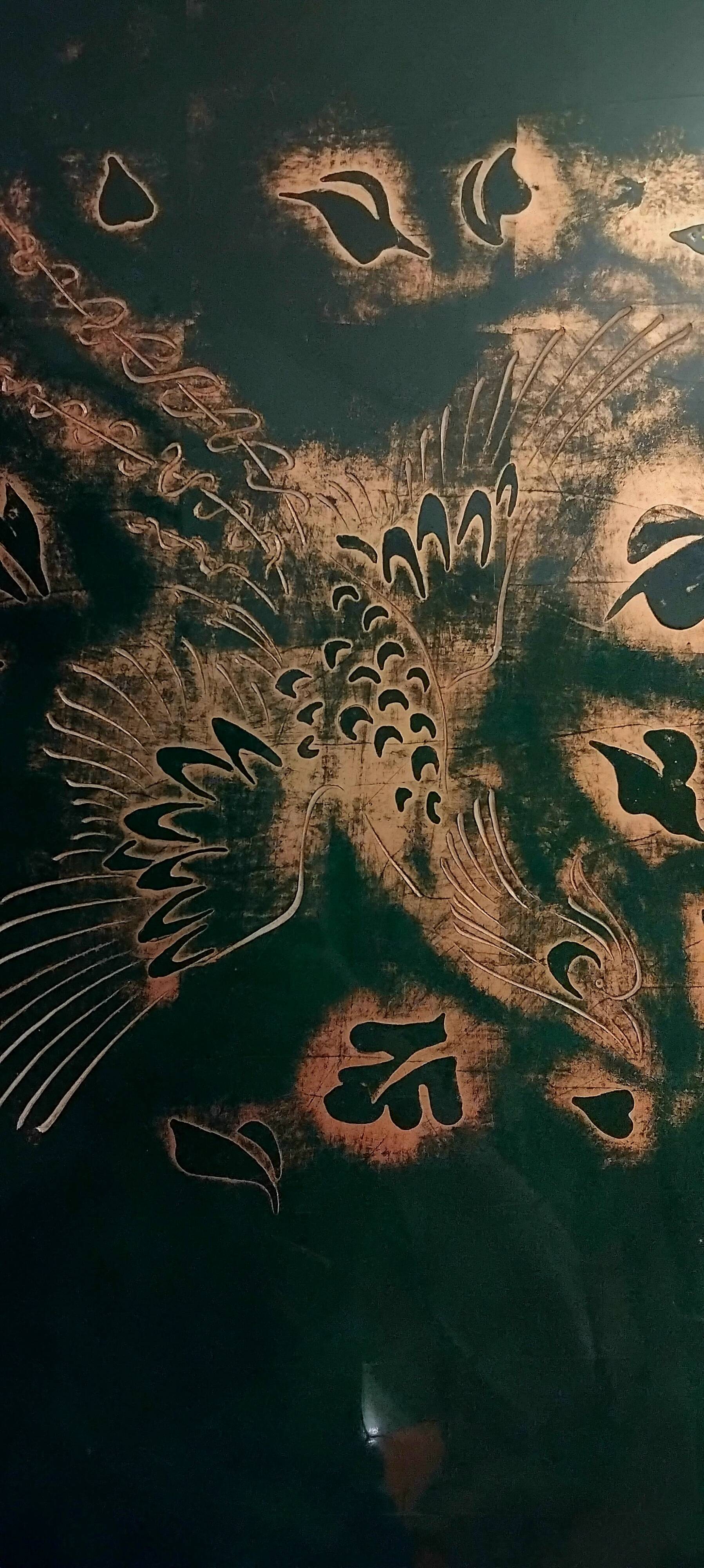 Two panels in lacquer and gold by Pierre Bobot.