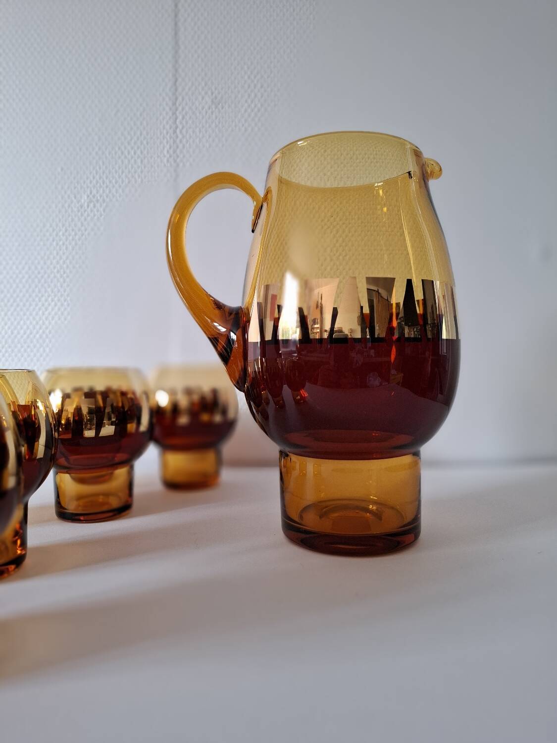 Carafe and its amber/golden glasses from the 70s.
