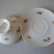 Old large tea cup and saucer in Limoges porcelain with flower decor