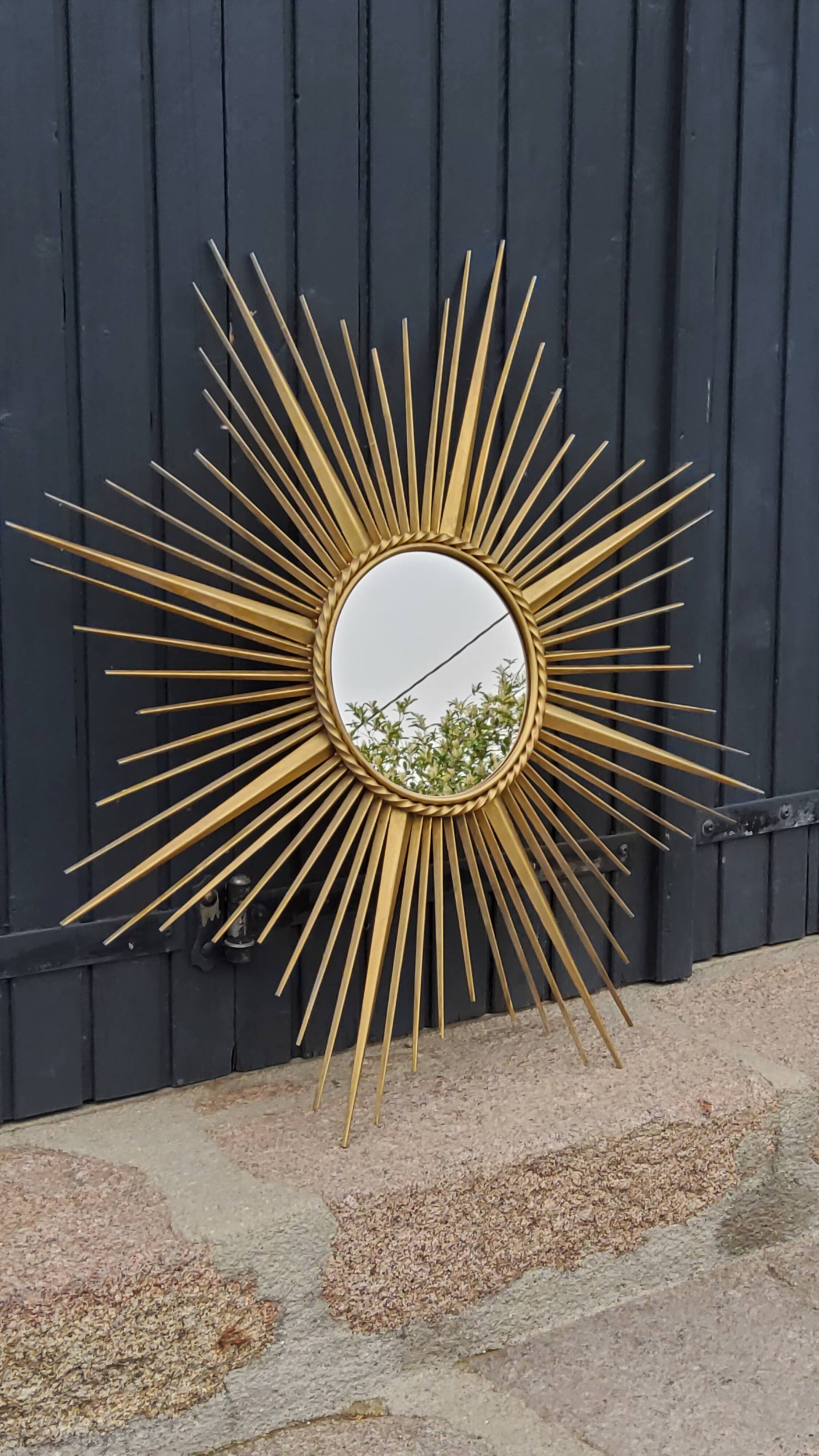 Miroir soleil Chaty Vallauris en métal doré