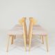 Set of 6 soft pink fabric dining chairs, Scandinavian design, natural wood.
