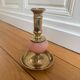 Pink glass and brass candlestick