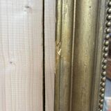 Miroir doré de style Louis XVI