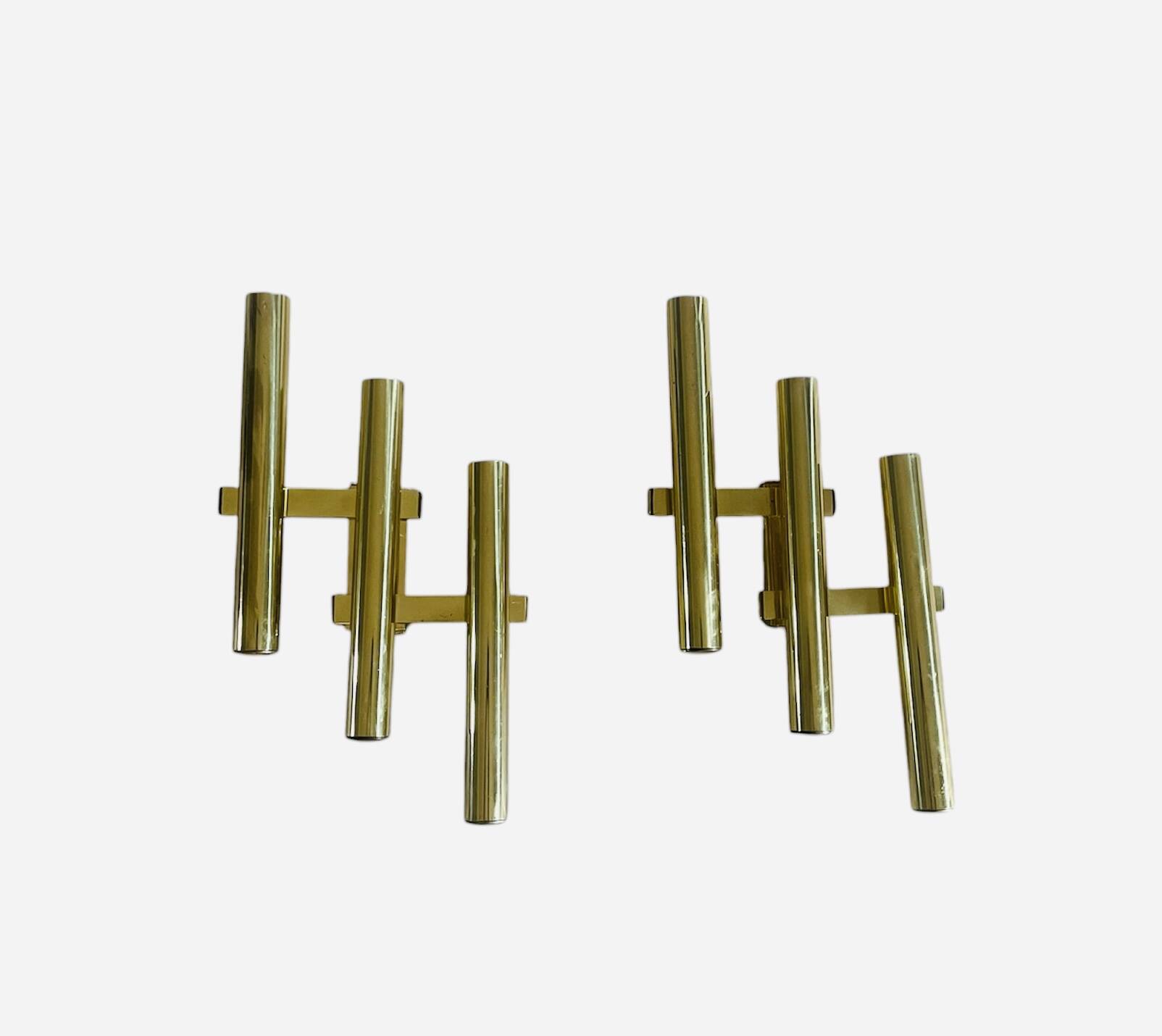 Tubular wall sconces in brass, Italian design from the 1970s, attributed.