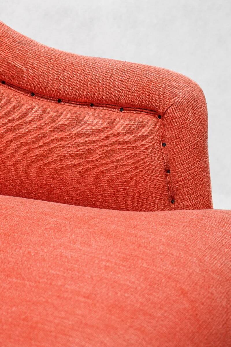 Napoleon III salon armchair in brick red linen with a tufted footrest.