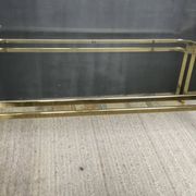 Vintage 1970s coffee table in gold metal and smoked glass.