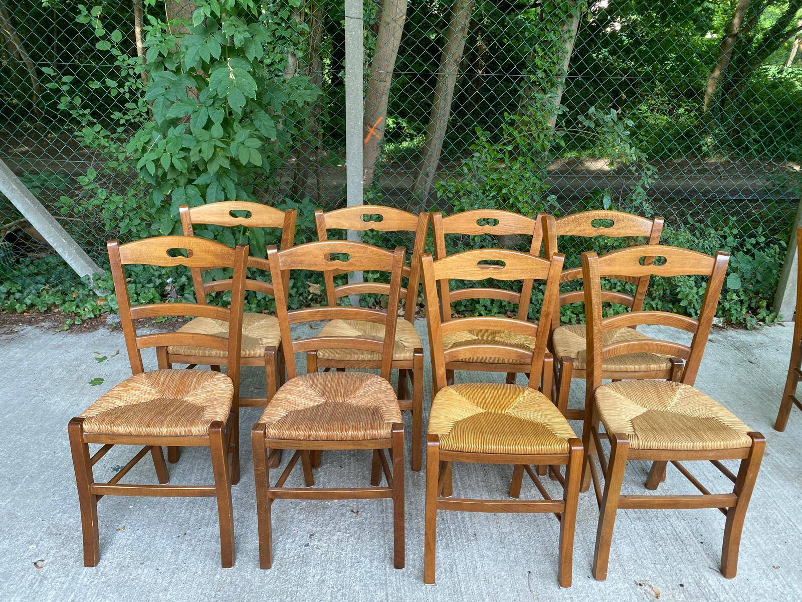12 solid wood and straw chairs