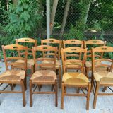 12 solid wood and straw chairs