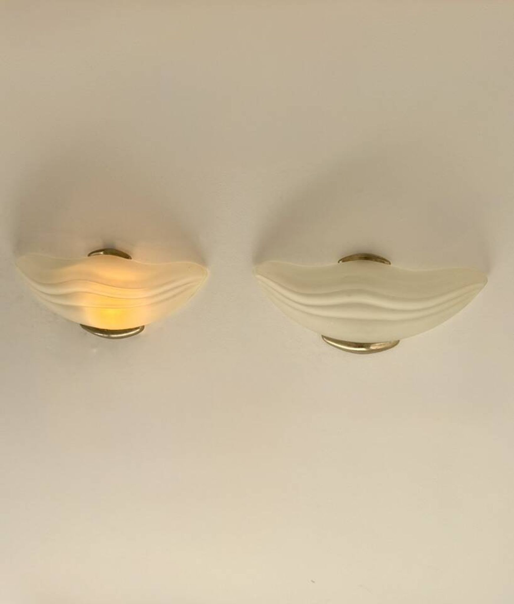 Pair of vintage wall lights in brass and frosted glass, Italy, 1970.