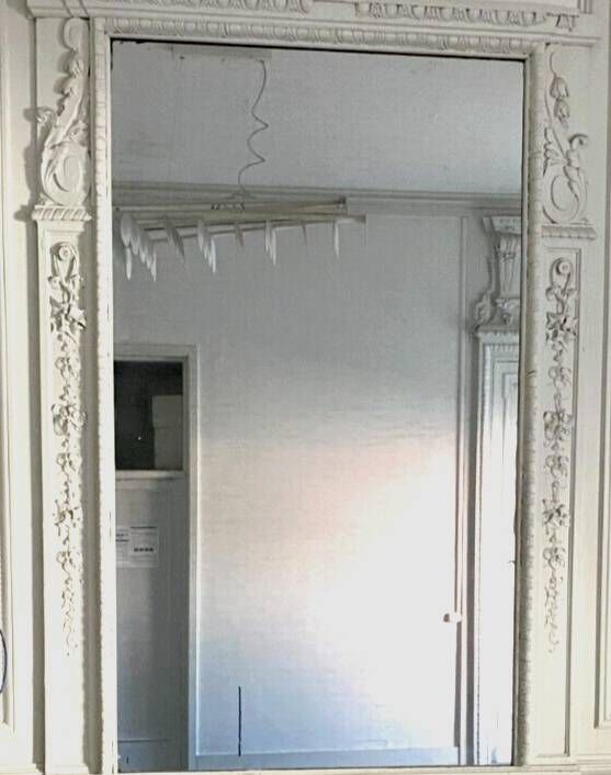 Louis XVI style mirror in wood and carved stucco 20th century