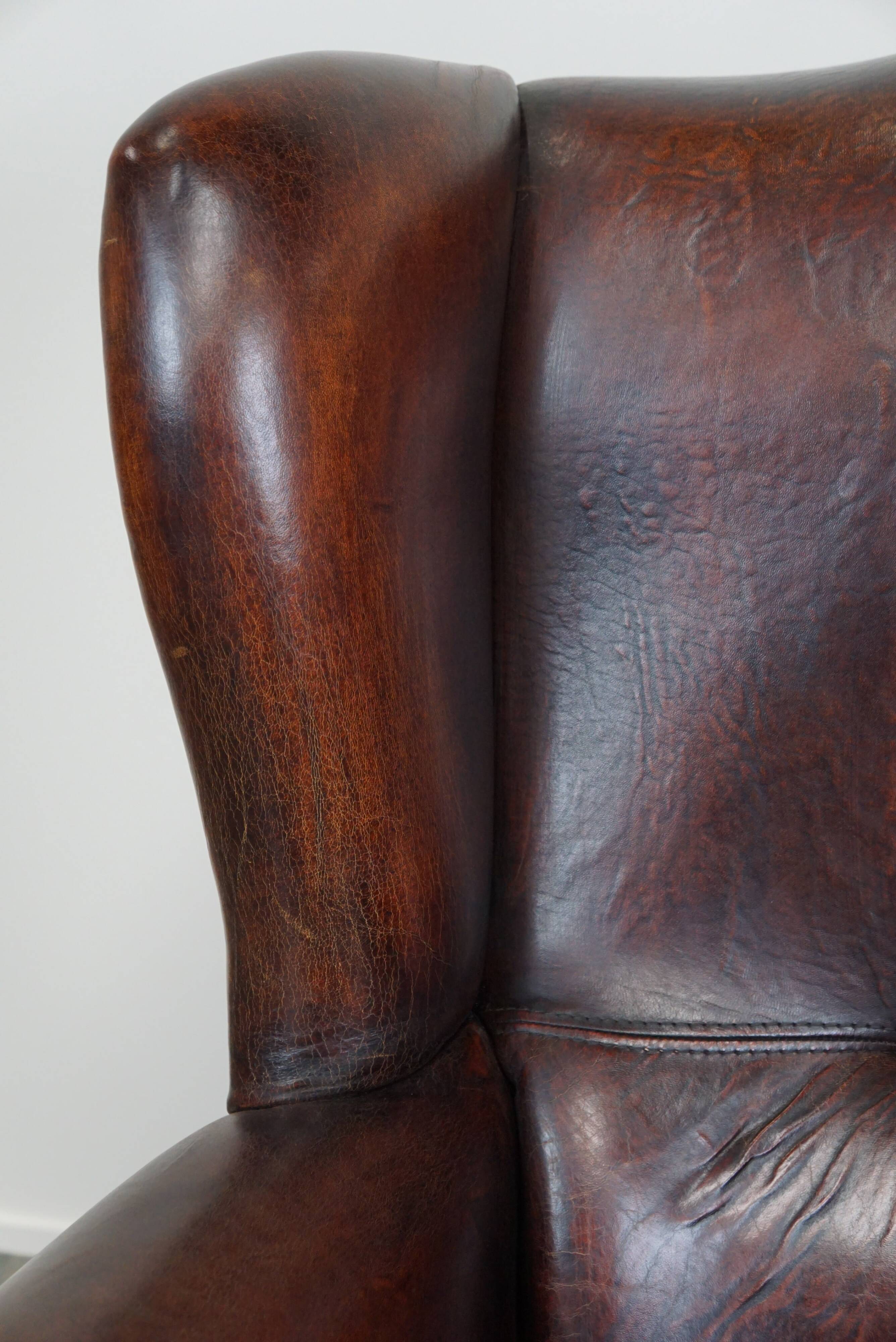 Large Sheepskin Leather Wingback Armchair with a Fixed Seat Cushion and a Stunning Patina