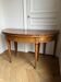 Large oval table from the early 19th century in walnut, 3.17m with extensions.