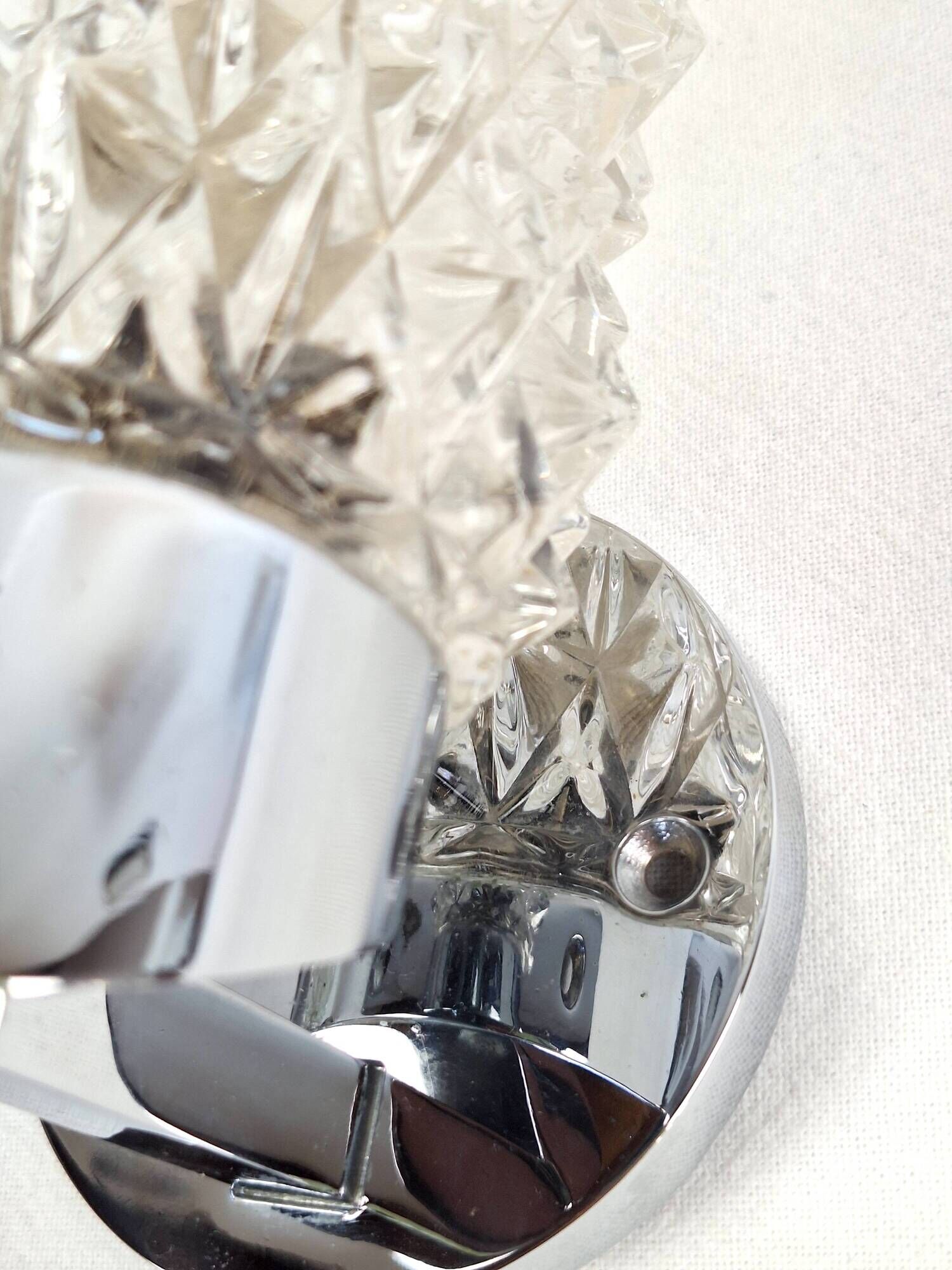 Pair of vintage Art Deco space age chrome and molded glass wall sconces