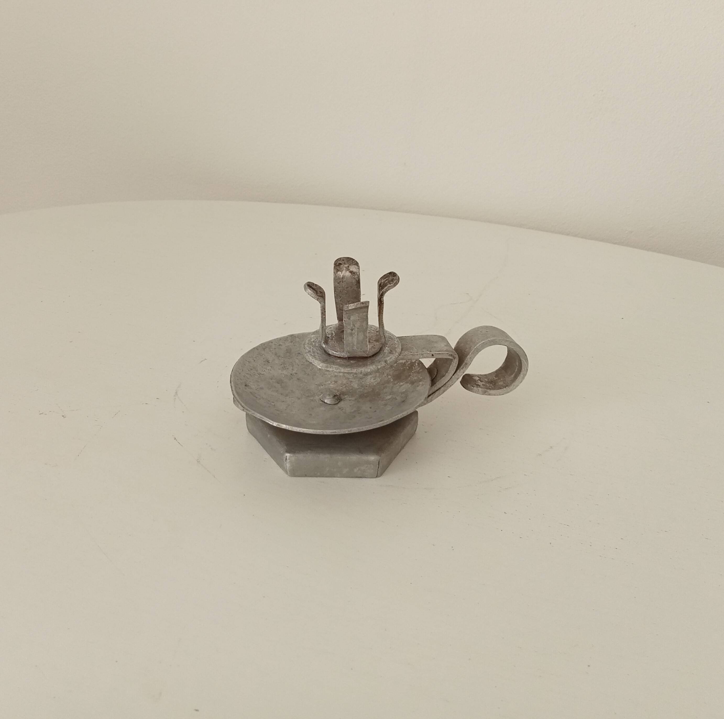 Vintage zinc hand candle holder