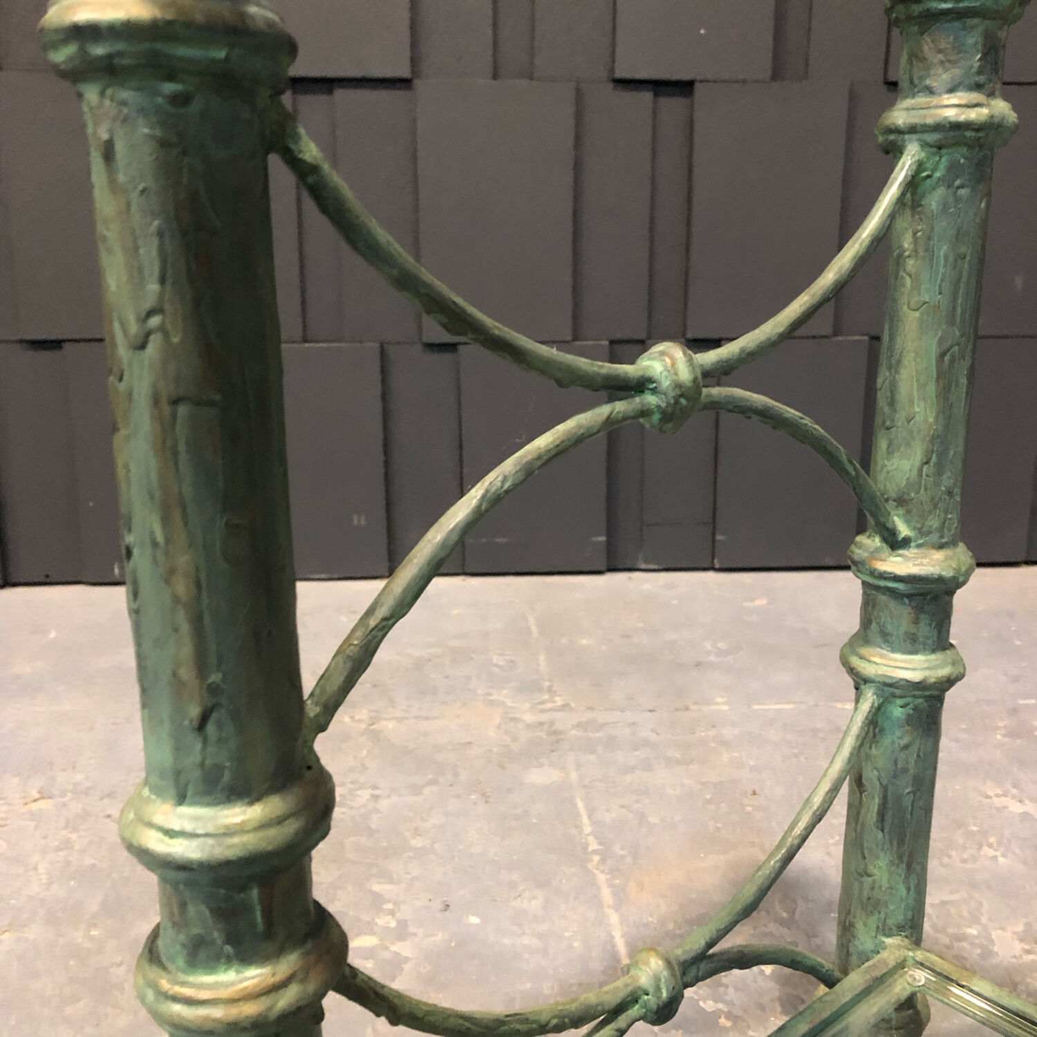 Iron and glass side table with antique patina