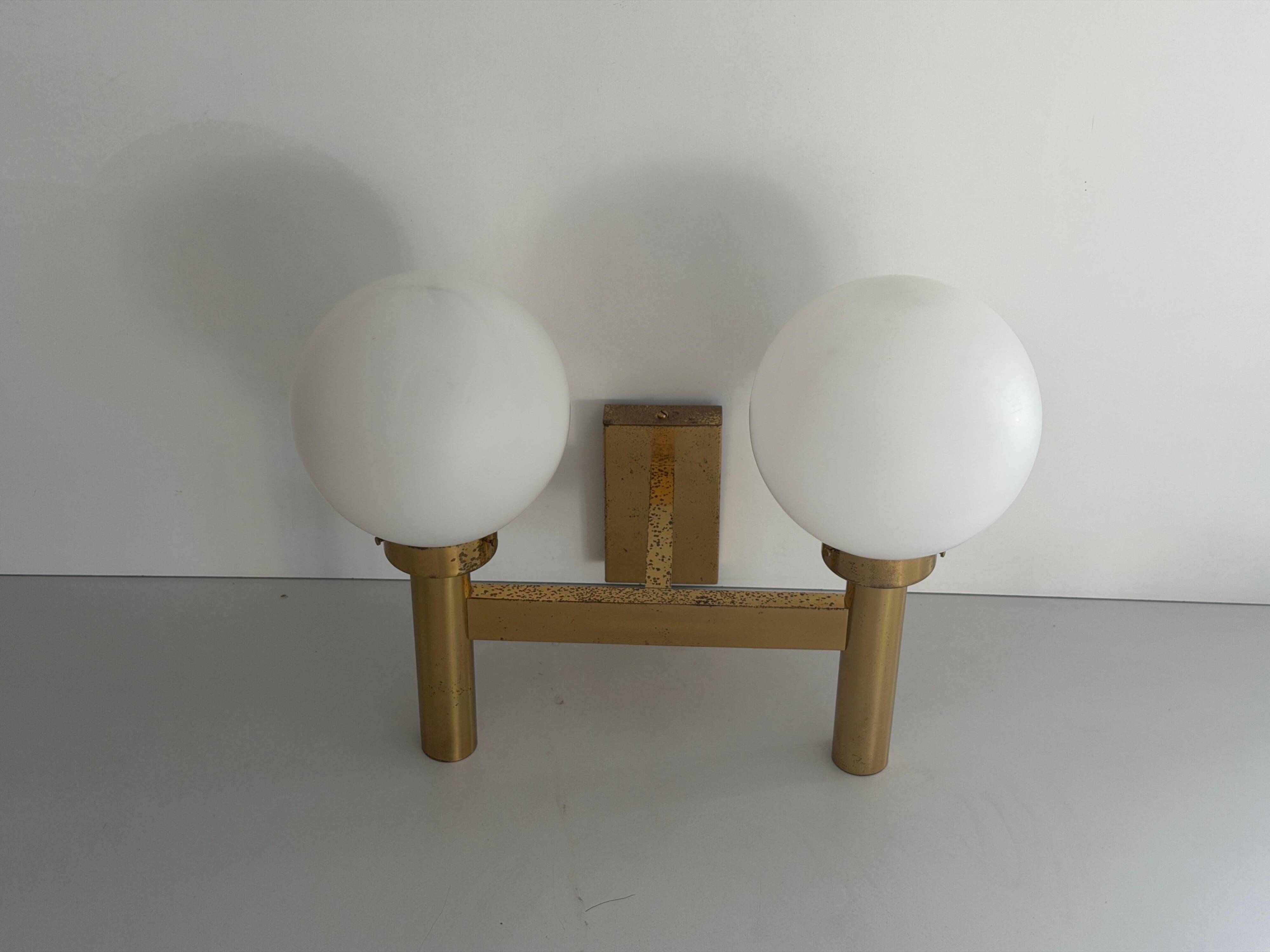 Double opal glass and heavy brass, large minimalist cinema wall light, 1960s, Germany