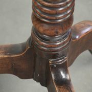 Antique English oak tilt top table from the 19th century in a unique shape