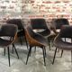 Scandinavian style chairs in curved plywood covered with brown fabric