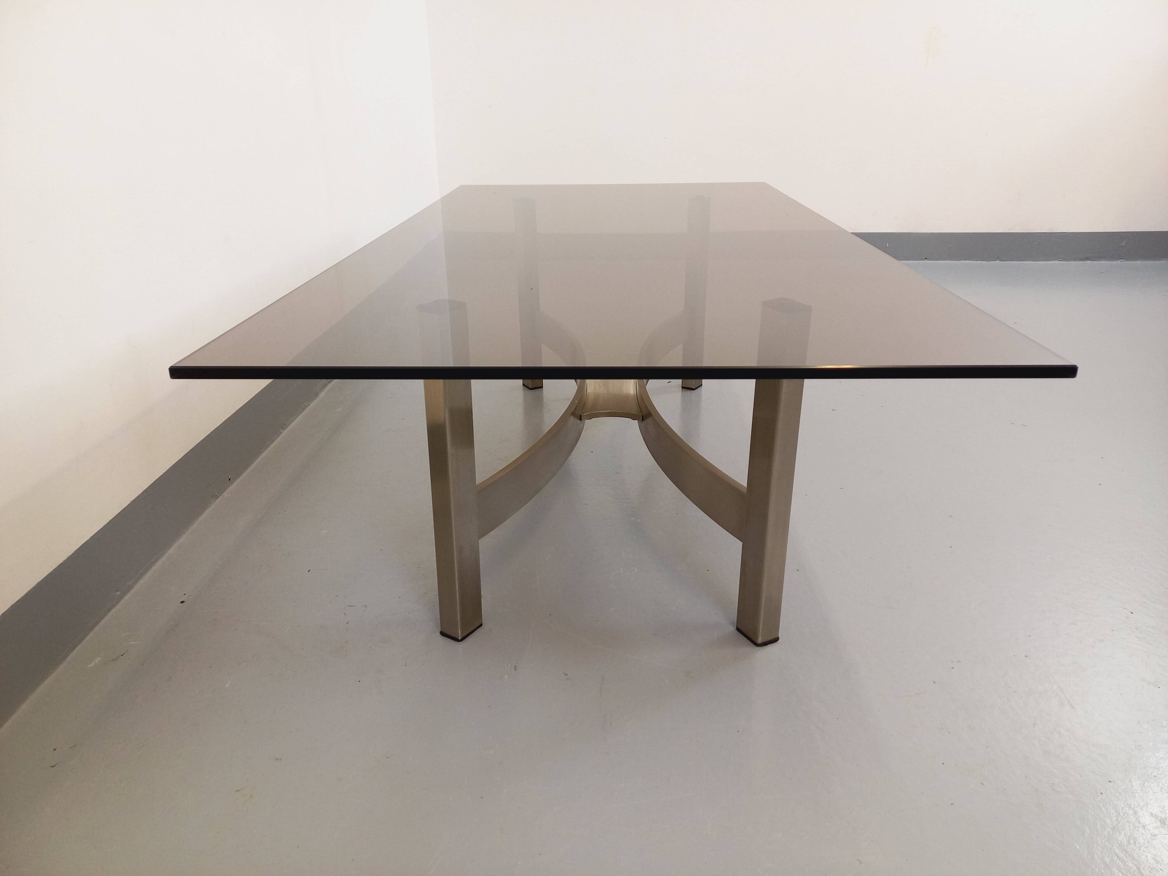 Vintage coffee table in smoked glass and brushed cast aluminum from the 70s