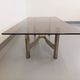 Vintage coffee table in smoked glass and brushed cast aluminum from the 70s