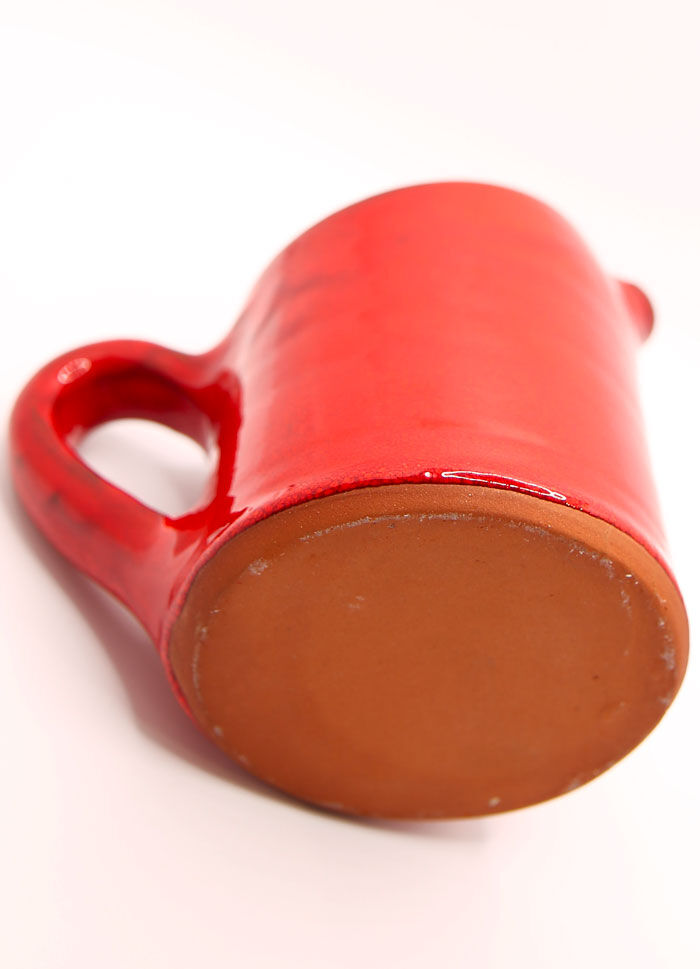 Bright red ceramic pitcher