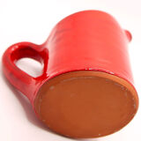Bright red ceramic pitcher