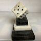 A marble dice bookend
