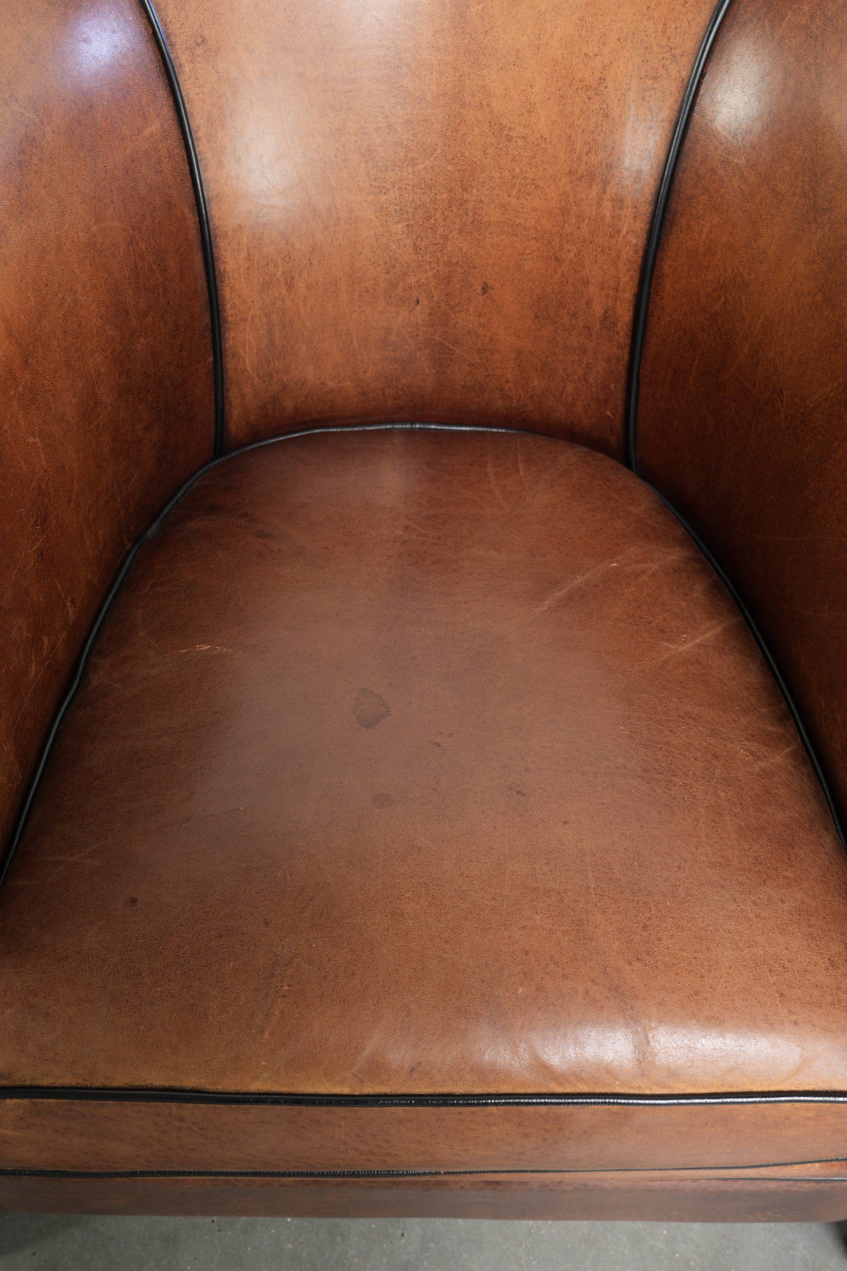Set of two sheepskin Art Deco design club armchairs with black piping