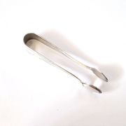 WMF vintage sugar tongs in silver-plated metal with crossed ribbon decoration.
