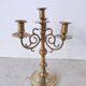Pair of four-light candle holders in gilded brass