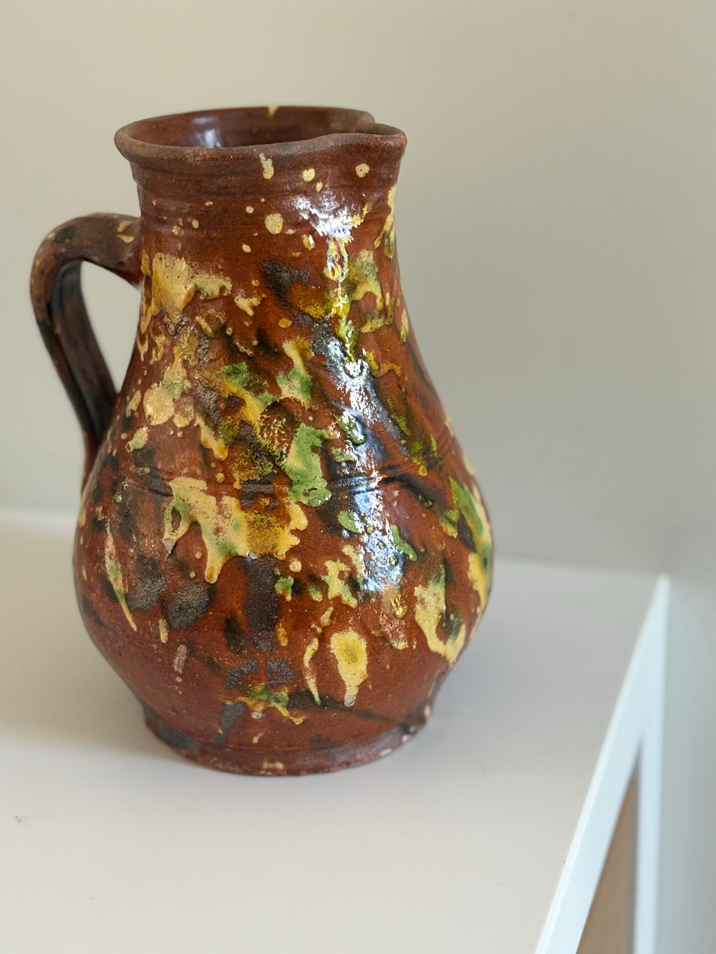 Studio ceramic pitcher with sprayed glazes – circa 1960-70