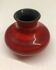 Red ceramic ball vase signed A