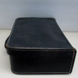 Small suitcase in old navy blue cardboard