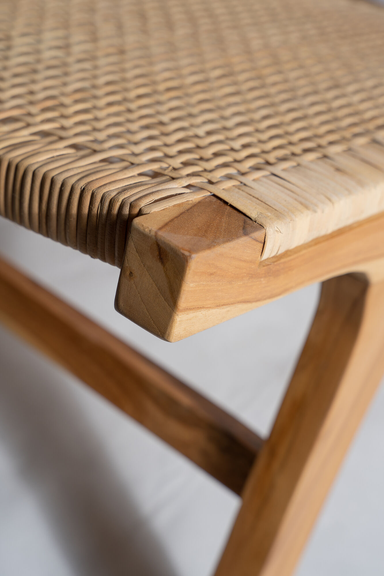 Reclining armchair in natural wood and woven rattan